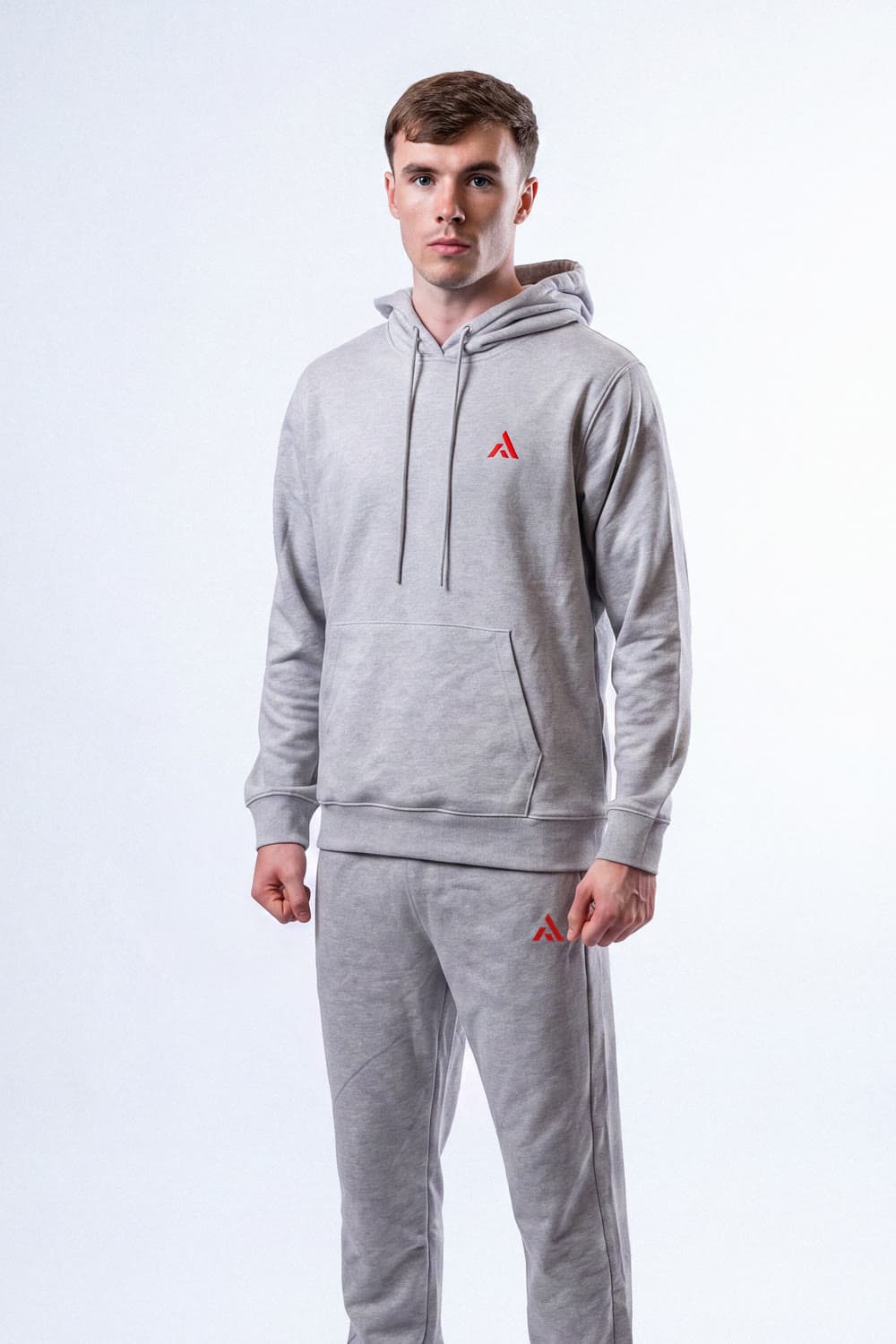 Athlete wearing the PEAK Essentials Tracksuit in grey